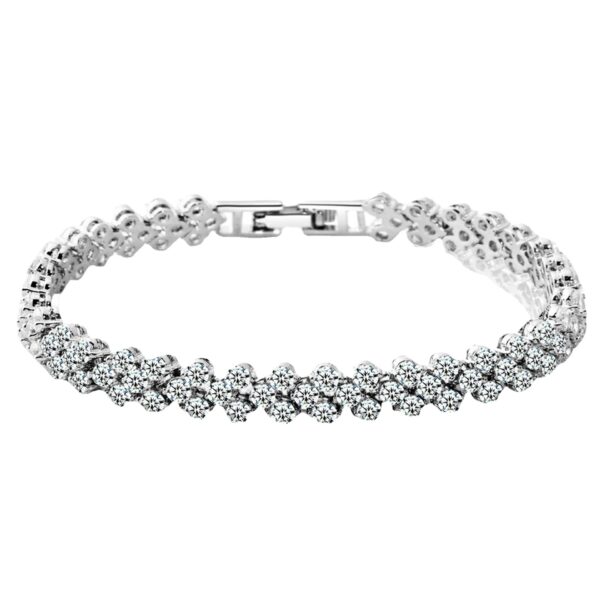 A silver bracelet with white stones on it.