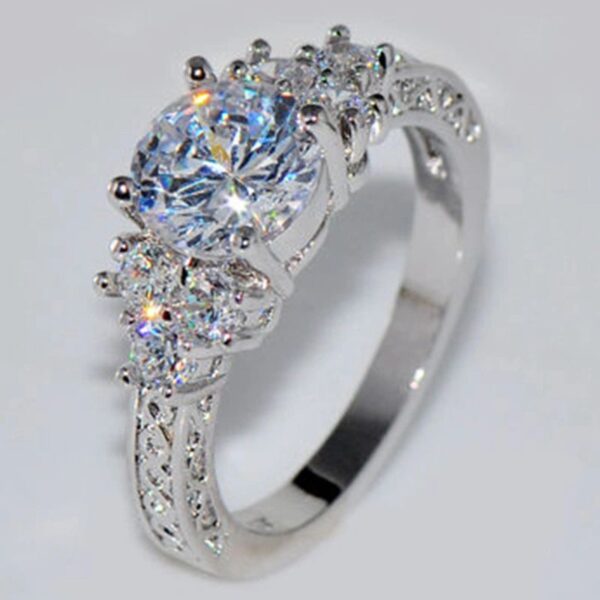 A diamond ring with three sides of diamonds on it.