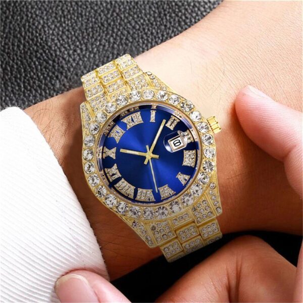 A person wearing a watch with gold and blue face