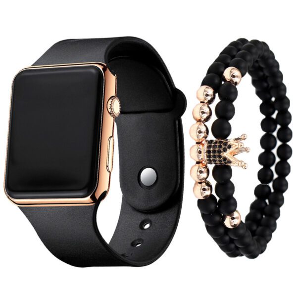 A black and gold apple watch with two bracelets.