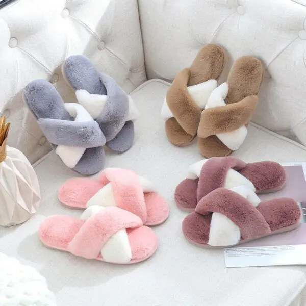 A group of four pairs of slippers sitting on top of a table.